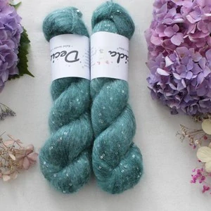 "Teal" - 34% superkid mohér 11% hedvábí 41% nylon 14% polyester 195m/50g