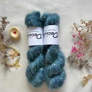 "Blue Thistle" - 34% superkid mohér 11% hedvábí 41% nylon 14% polyester 195m/50g