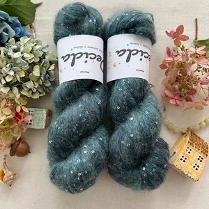 "Menton" - 34% superkid mohér 11% hedvábí 41% nylon 14% polyester 390m/100g