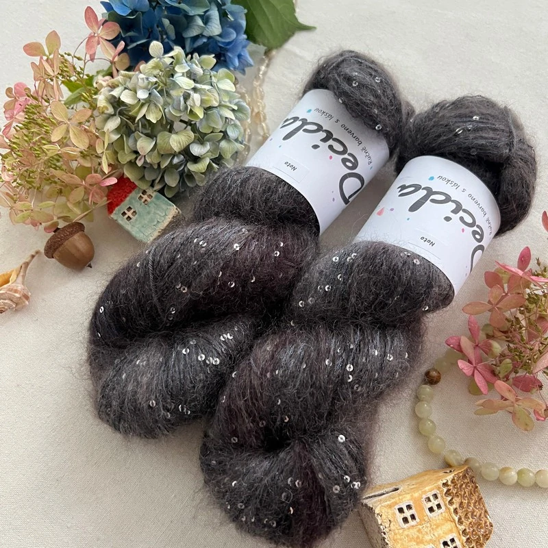 "Noto" - 34% superkid mohér 11% hedvábí 41% nylon 14% polyester 390m/100g
